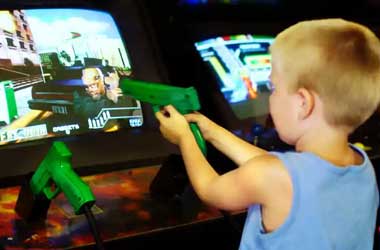 Child playing an Arcade Game