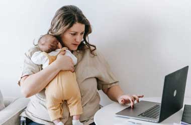 New mother on a laptop gambling